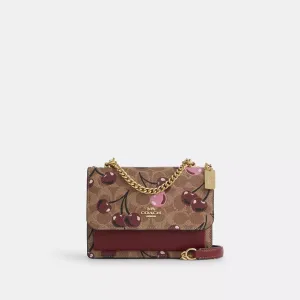 Coach Outlet Mini Klare Crossbody Bag In Signature Canvas With Cherry Print